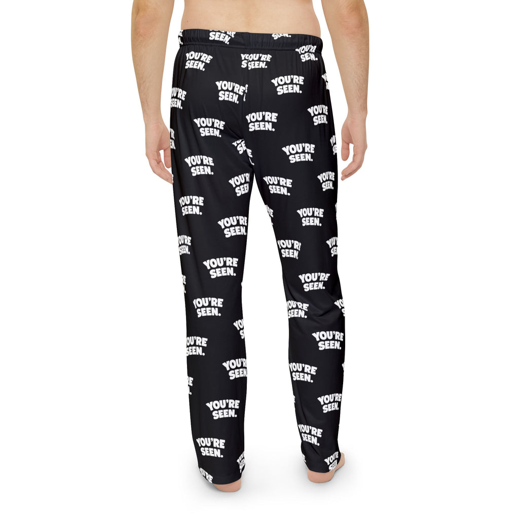 YOU'RE SEEN Repeat Text Pajama Pants | Black All-Over Print